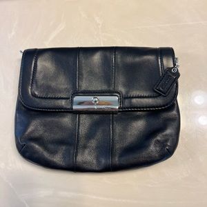 Coach black leather clutch with rings to add a strap